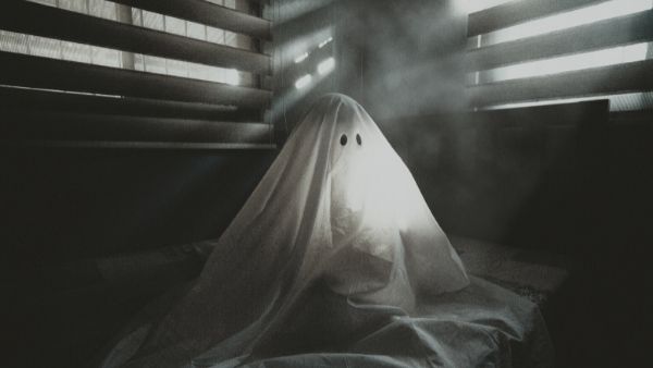 Black and White ghost on bed