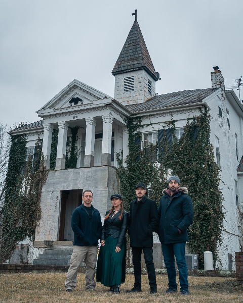 Mustafa Gatollari, Malia Miglino, Brandon Alvis and Kevin Otte in front of a white house