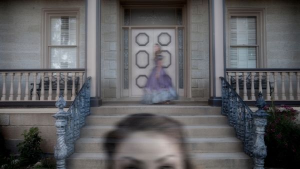 ghosts of southern ladies outside an old possibly antebellum home