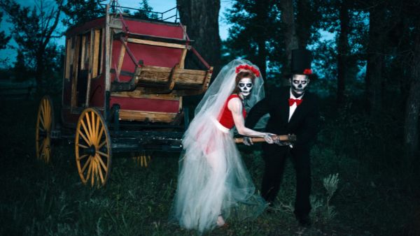 Haunted bride and groom pulling a stagecoach
