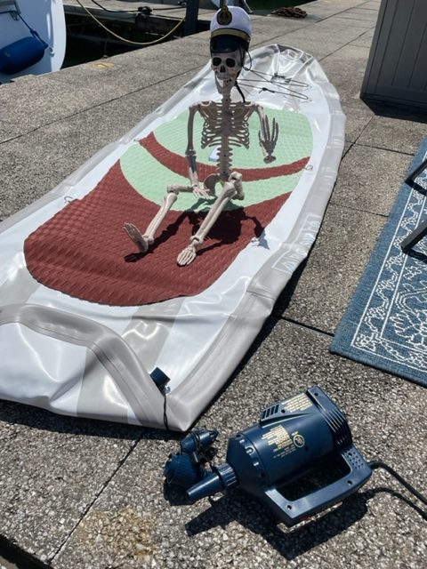 Smalls Skeleton preparing to inflate stand up paddle board