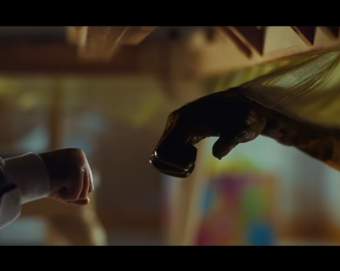 Gordy bloody exploding fist bump screenshpot from Nope Super Bowl Trailer