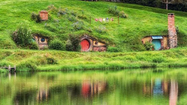 Hobbiton Houses reflecting on lake