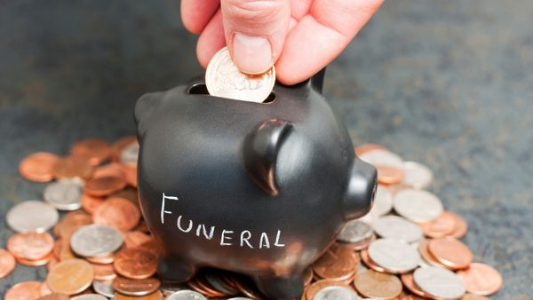 Funeral fund in black piggy bank