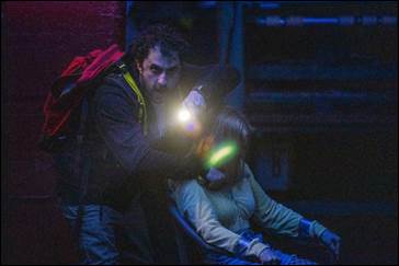 Man with backpack and woman tied up in chair scene from Urban Legend series