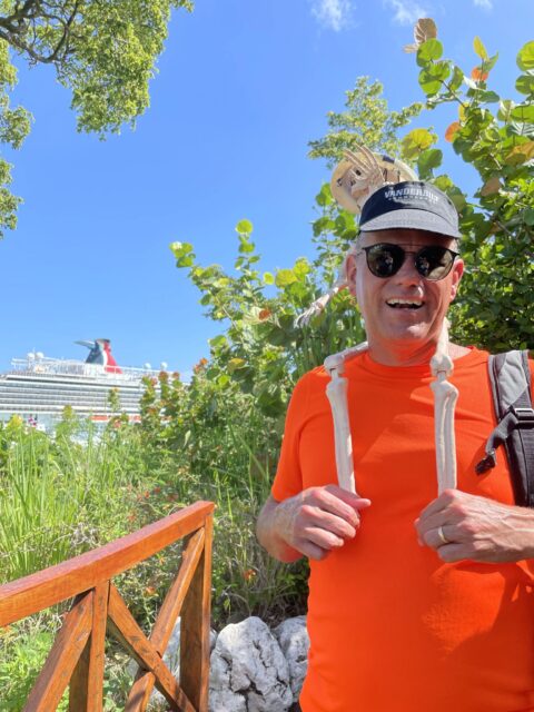 Smalls Skeleton getting shoulder ride touring Amber Cove during Carnival cruise stop in Dominican Republic