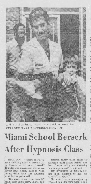 Newspaper clipping from the Tampa Tribune showing student being carried from Miami Aerospace Academy after hypnosis devil oujia board riot