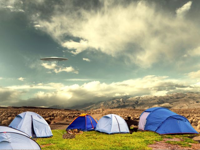 Campground with tents in a valley and UFO in the sky