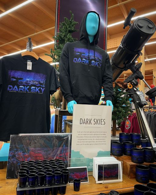 Telescope, T-shirts, books and creepy alien-like mannequin Dark Sky display at a the Grand Canyon Village Market & Deli store in Arizona.