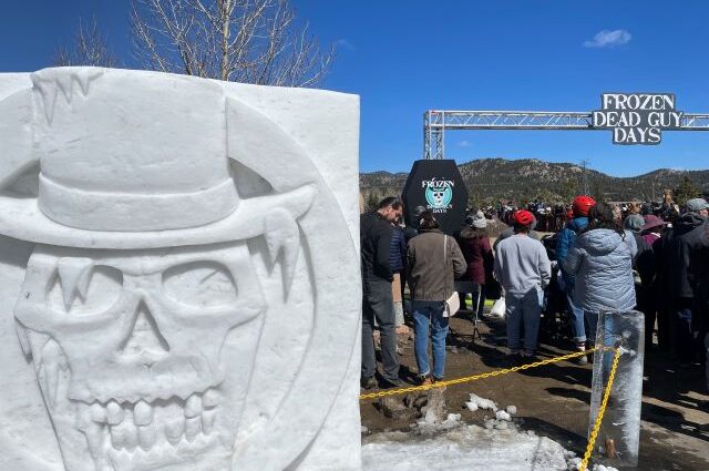 A frozen dead guy carving at the festival