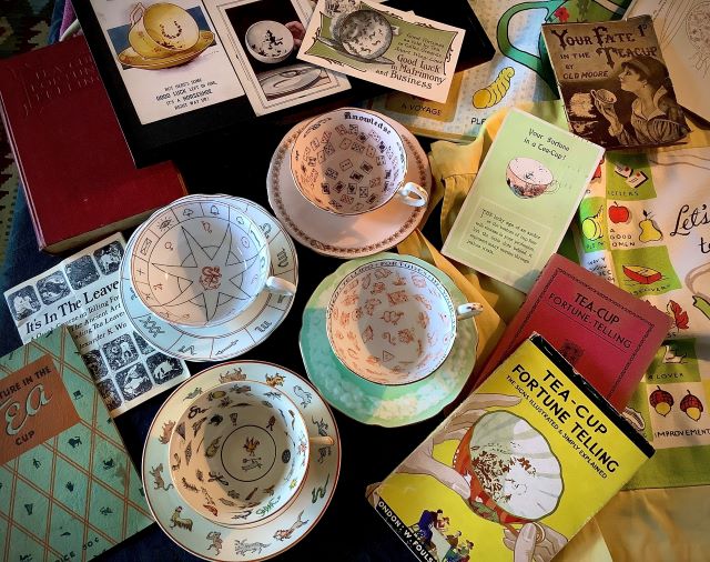 Tasseomancy Museum photo of tea leaf reading cups and books